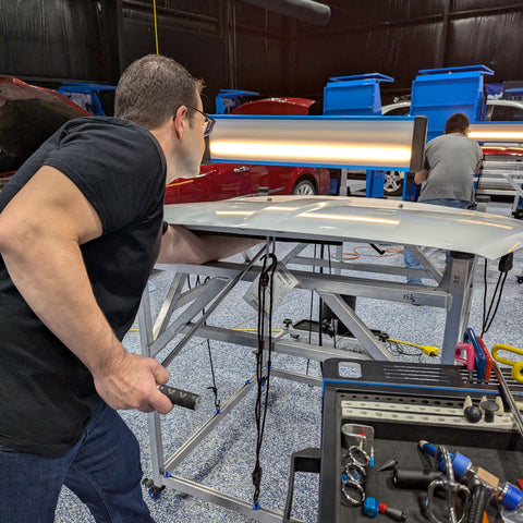 Rob performing glue pulling on a hood using KECO Body Repair Products