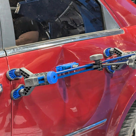 Using the K-Beam Bridge Lifter to pull and repair a large dent on a car door